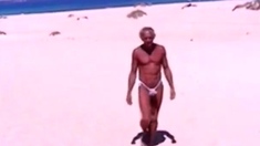 Beach Striptease: Tanned Hunk Bares All