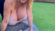 Busty babe playing with her big boobs