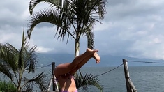 Petite Asian Yoga Instructor Doing Yoga At The Lake While