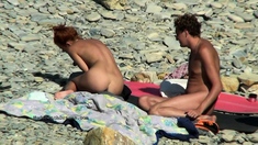 Voyeur Guy wanking and fuck redhead girl on a public beach