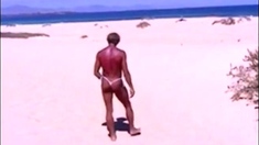 Tanned guy on beach in tiny string thong (temporarily!)